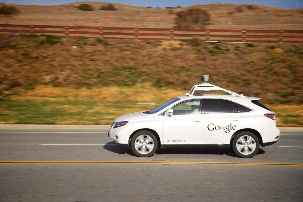 A Google autonomous vehicle in motion on a country road