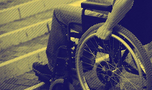 Wheelchair user at the bottom of a staircase