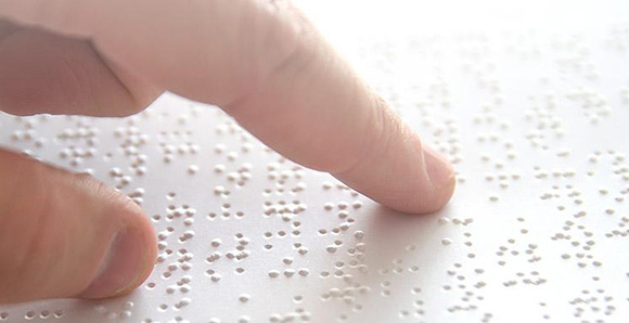 finger on a braille page