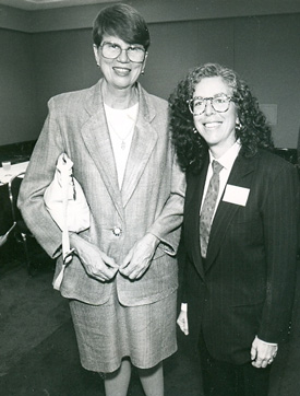 Janet Reno and Arlene Mayerson standing side by side smiling for camera