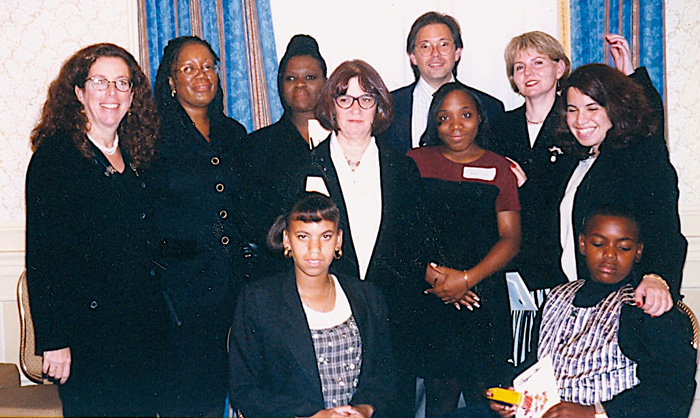 Large group photo. All smiling for camera.