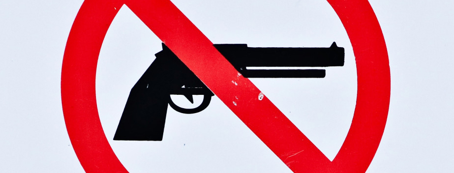 Hand gun with red line across it