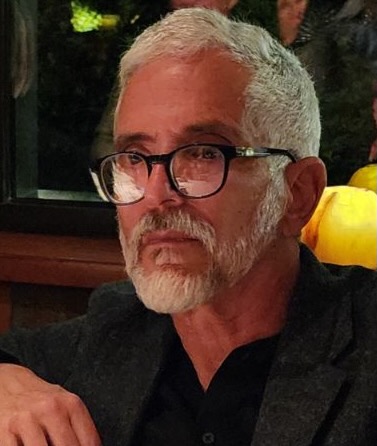 Photo of Steve Kaye, an older white man with fairly short gray hair and beard and wearing blue-framed eyeglasses.