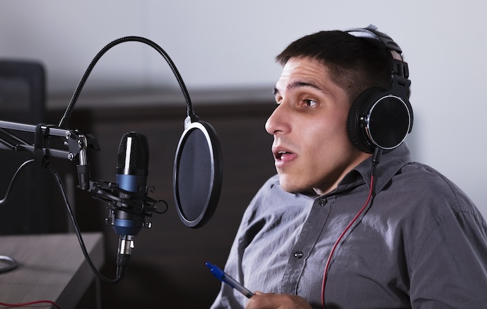 A person recording a podcast