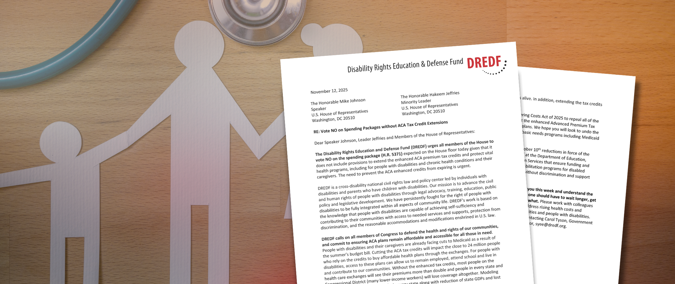 Letter with DREDF letterhead on top of a background with a stethoscope and a paper cut out of a family