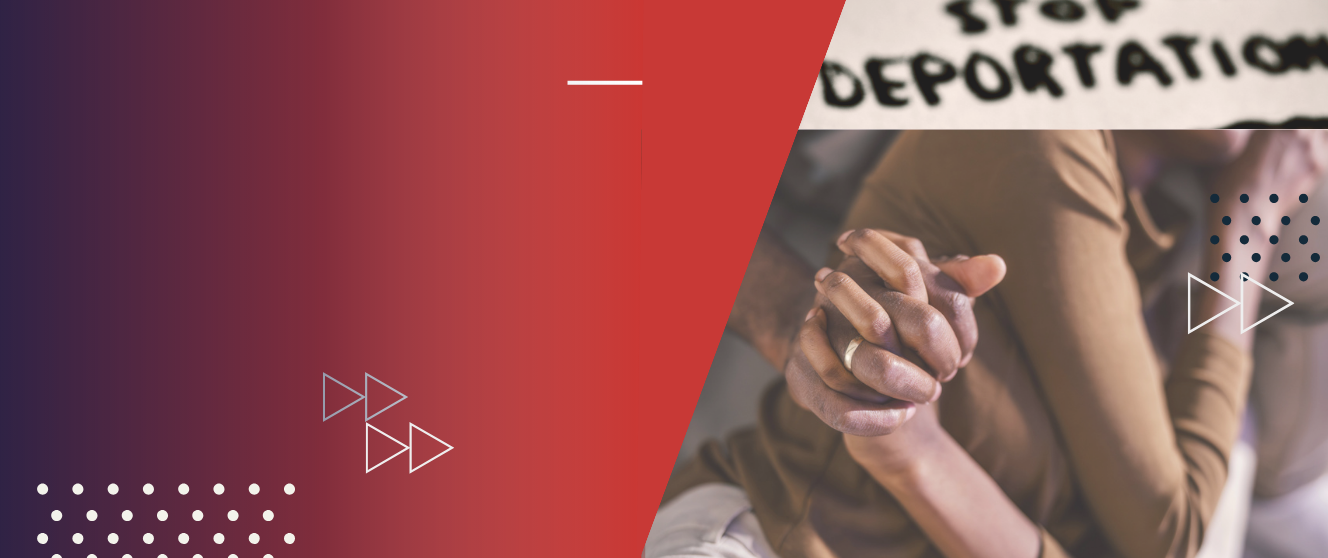 Close up of two people holding hands with a painted sign above that reads 