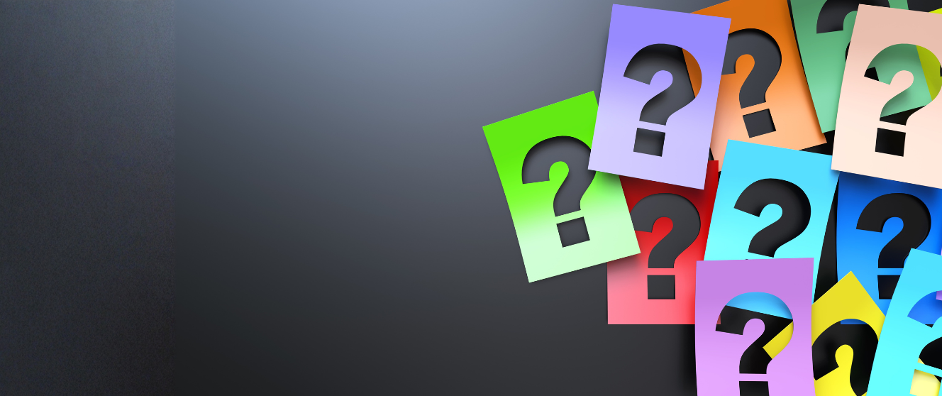 Cut outs of question marks in an array of colors