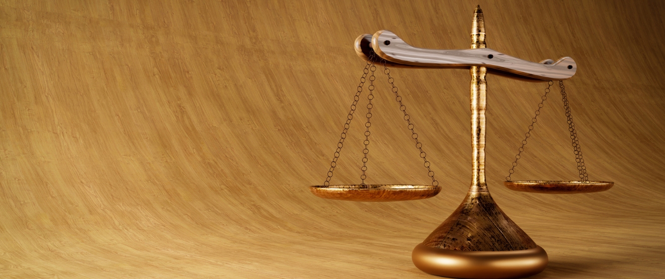 The scaled of justice on a gradient of wood